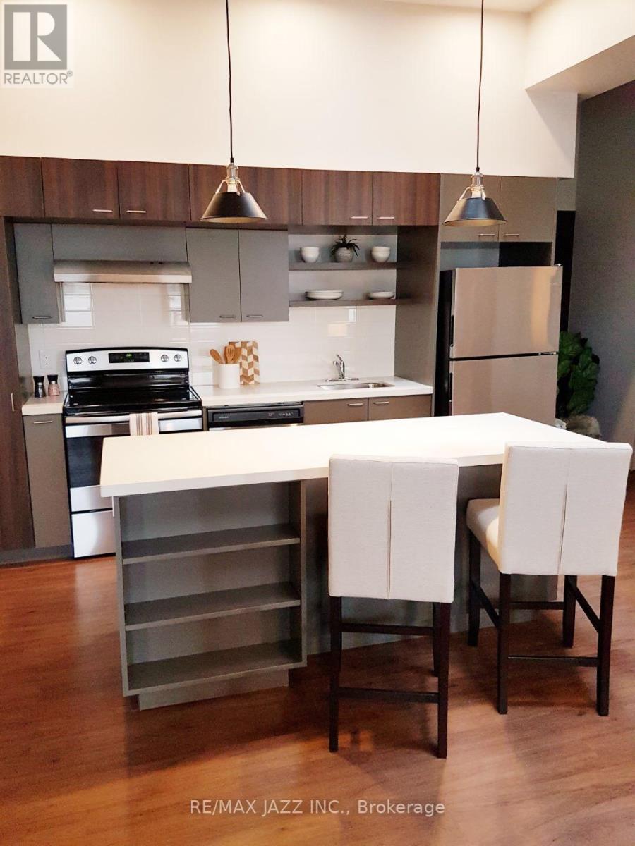 A modern kitchen with a dining table and chairs.