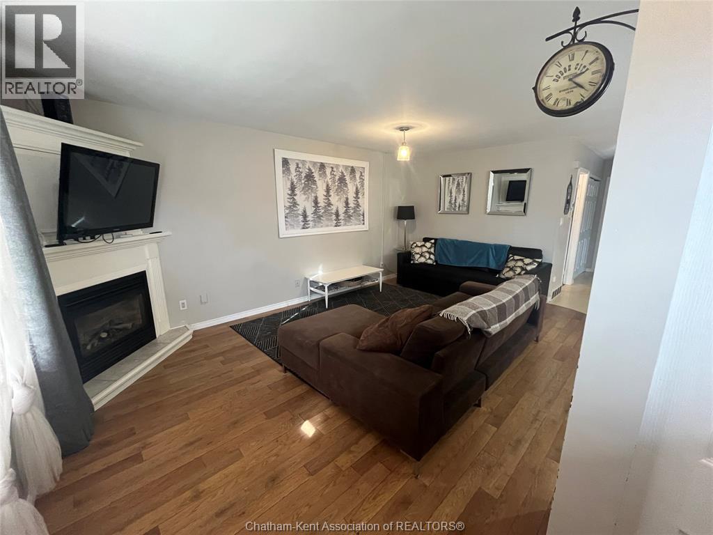 A living room with a fireplace and a couch.