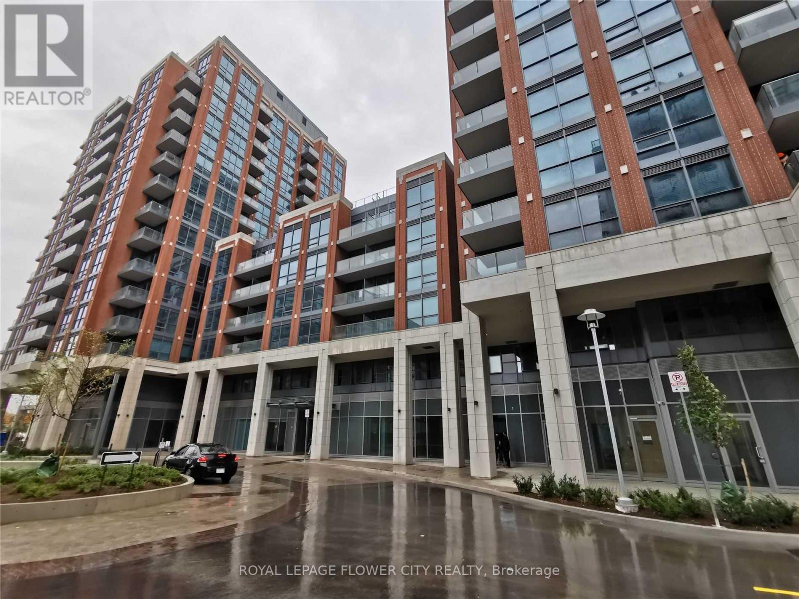 A building with a sign that says Royal LePage Flower City Realty, Brokerage.