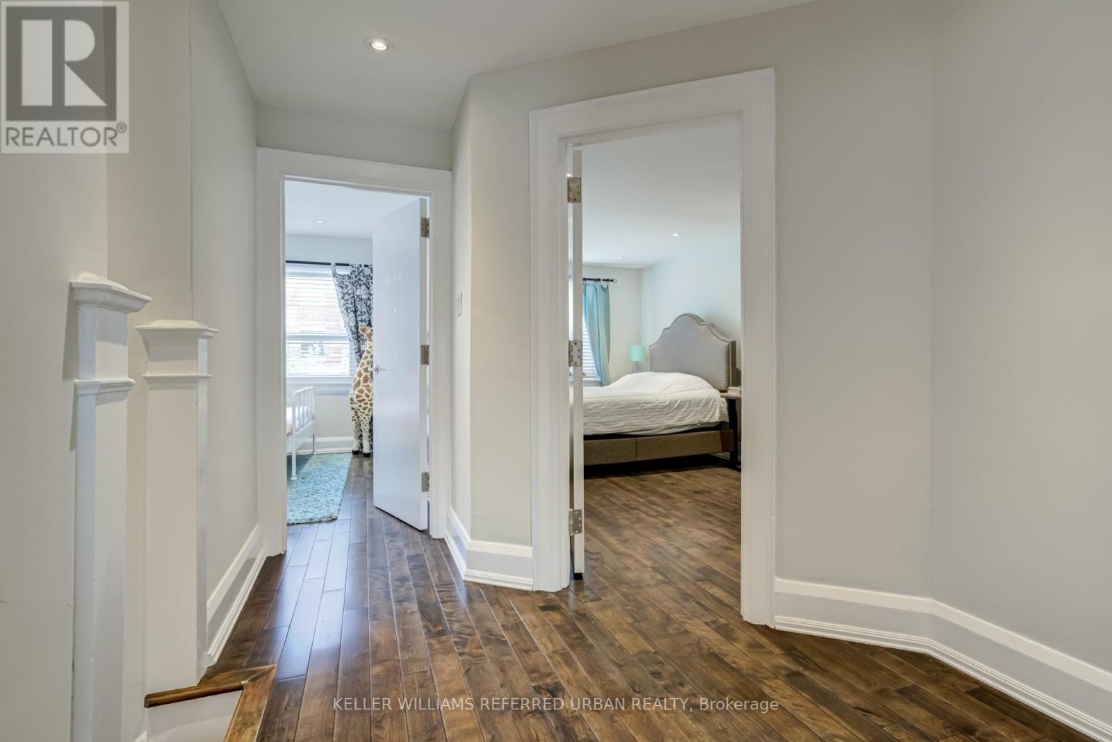 A bedroom with a bed and a window.
