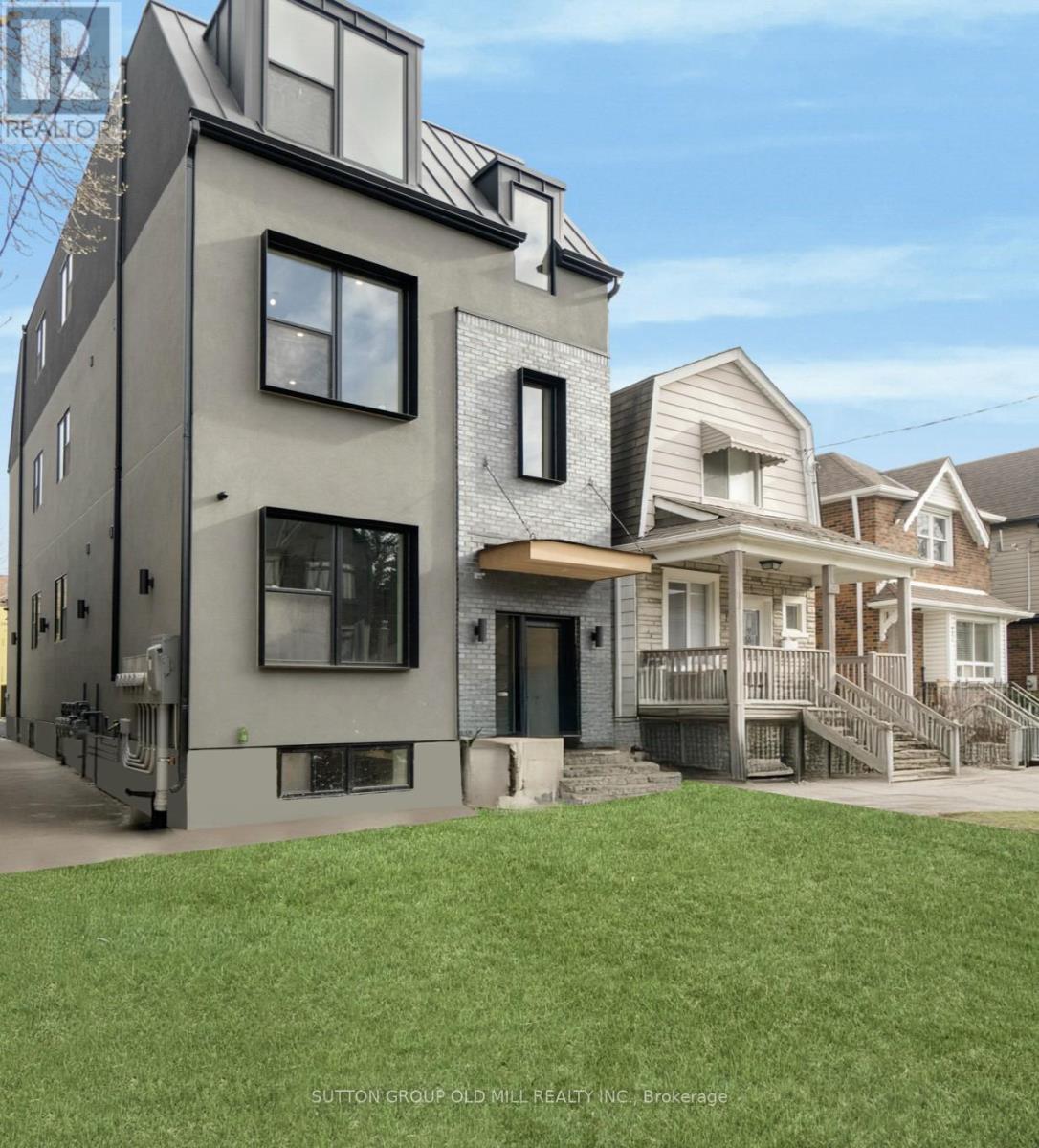 A modern house with a grey facade is shown in the image.