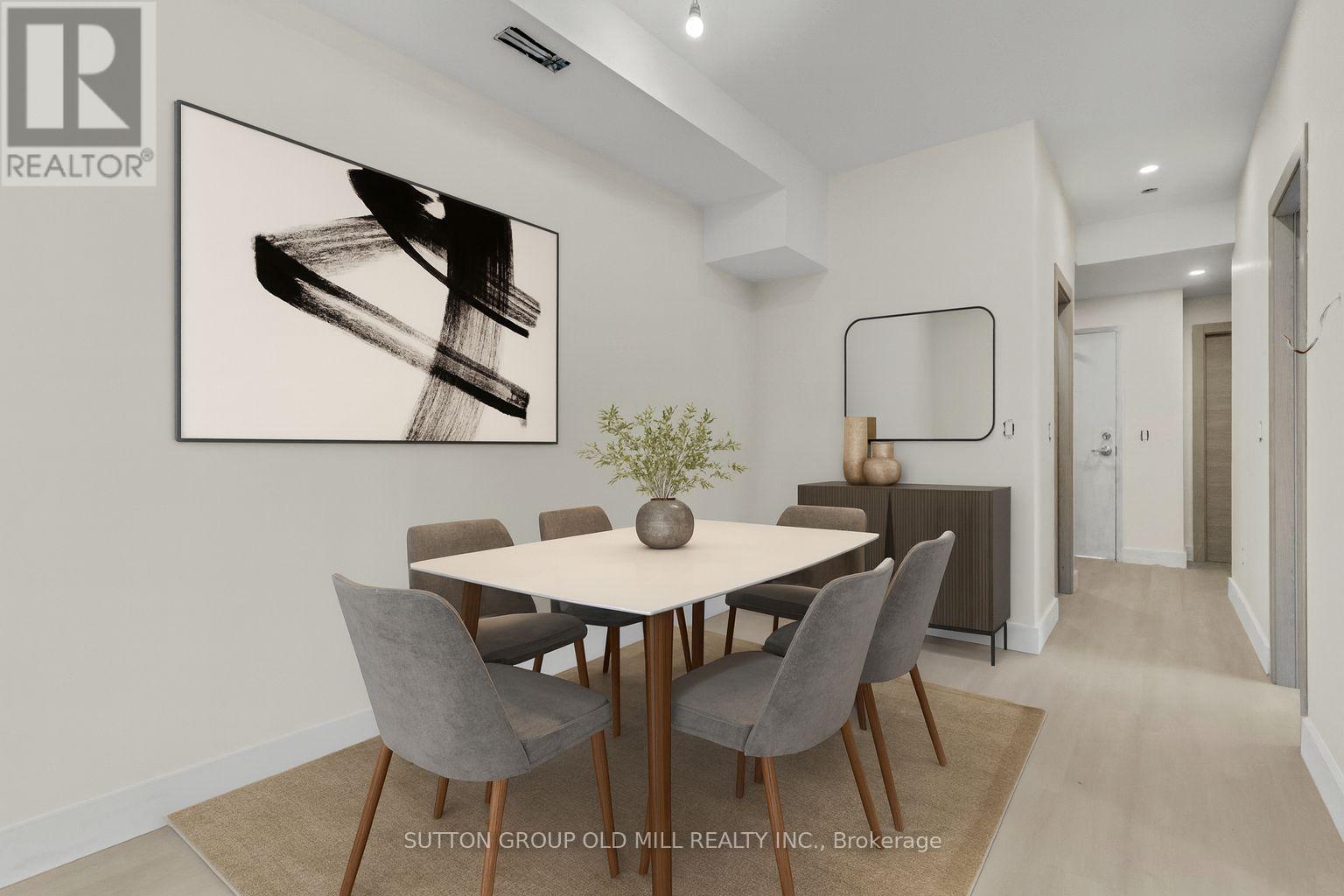 A dining room with a table set for four.