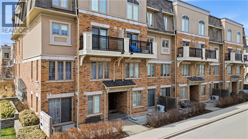 A row of apartment buildings with balconies and windows.