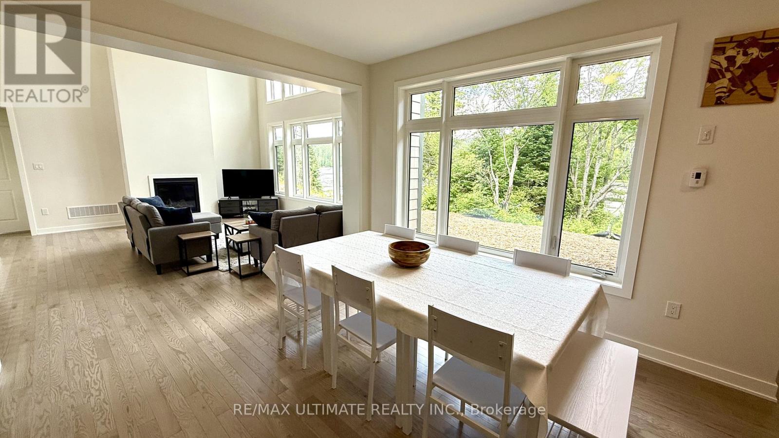 A dining room with a table and chairs is shown in the image.