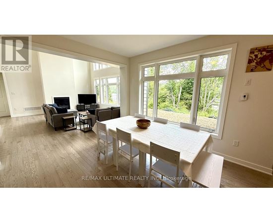 A dining room with a table and chairs is shown in the image.