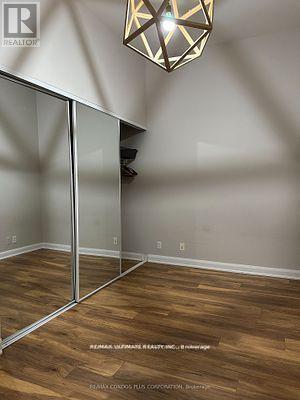 A room with wooden floors and a glass partition wall.