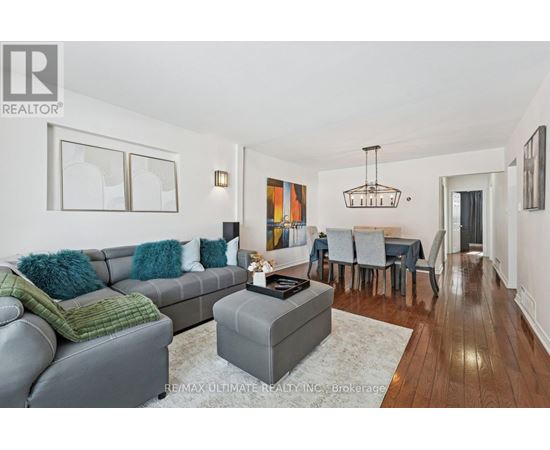 A living room with a grey couch and a coffee table.