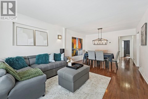 A living room with a grey couch and a coffee table.