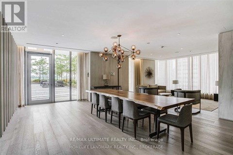 A modern dining room with a long table and chairs.