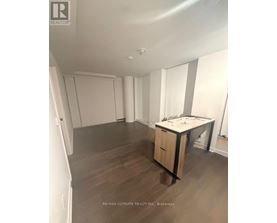 A room with a desk and a cabinet in it.