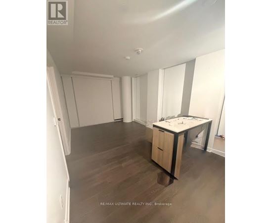 A room with a desk and a cabinet in it.