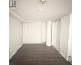 A large empty room with a white ceiling and floor.