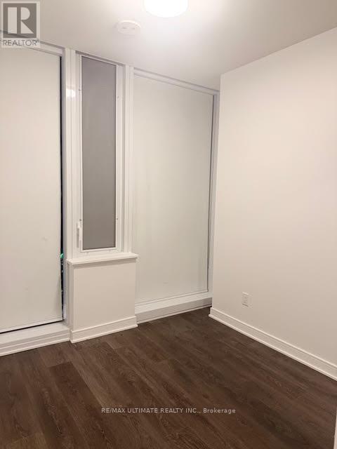 A room with a window and a door.
