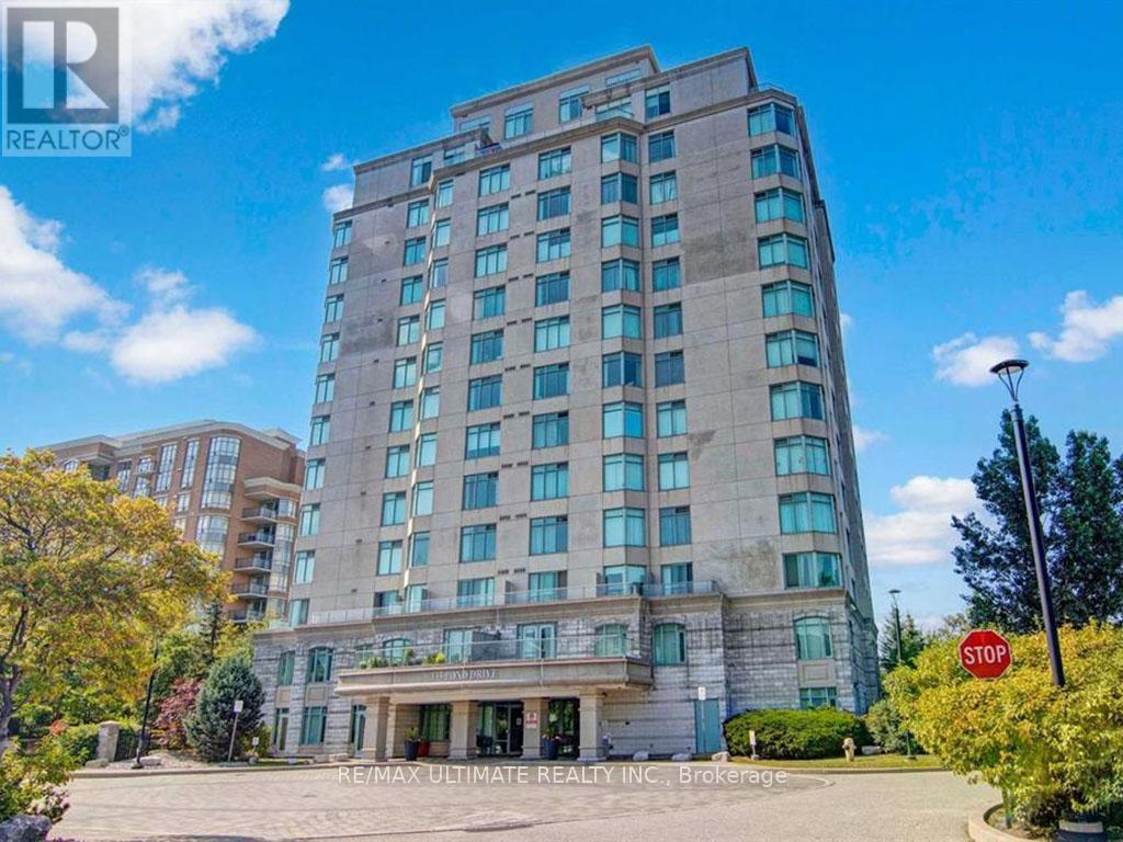 A tall building with a stop sign in front of it.