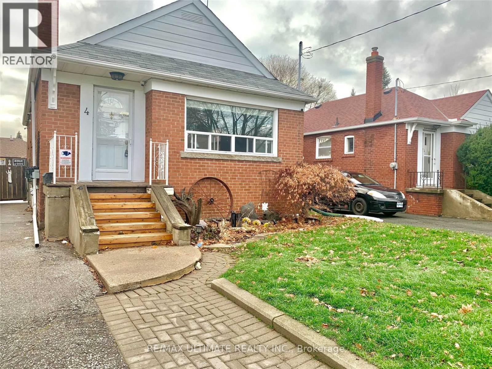 A house with a brick facade and a white door is for sale.
