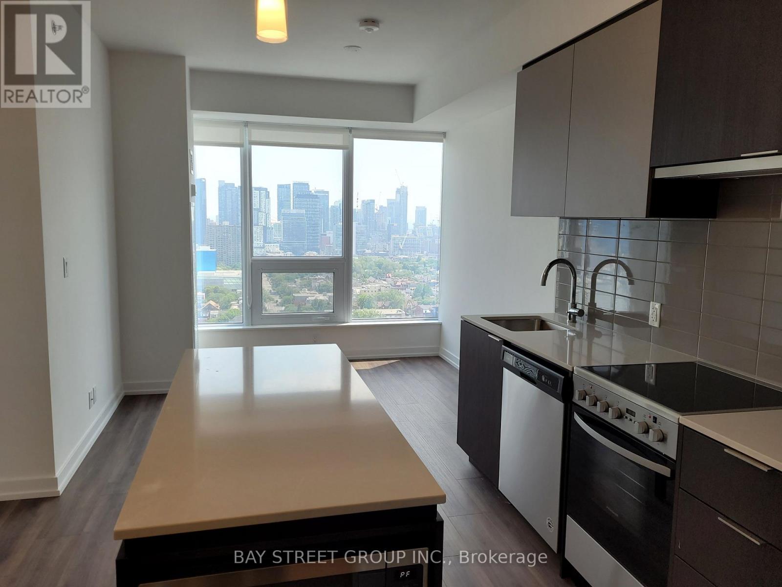 A kitchen with a view of the city.