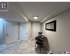 A room with a table and chairs in it.