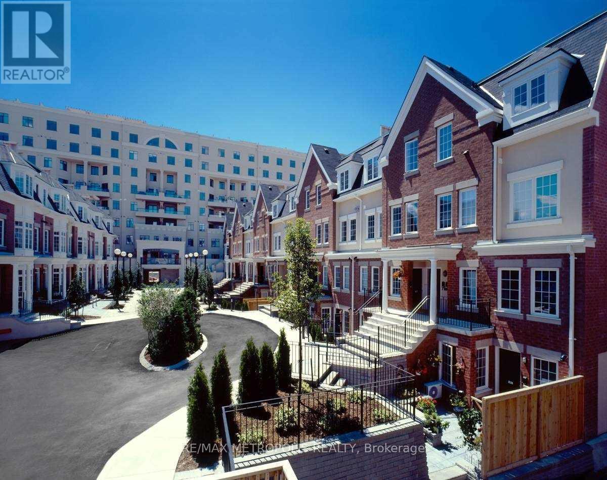 A realtor photo of a residential area with apartment buildings.
