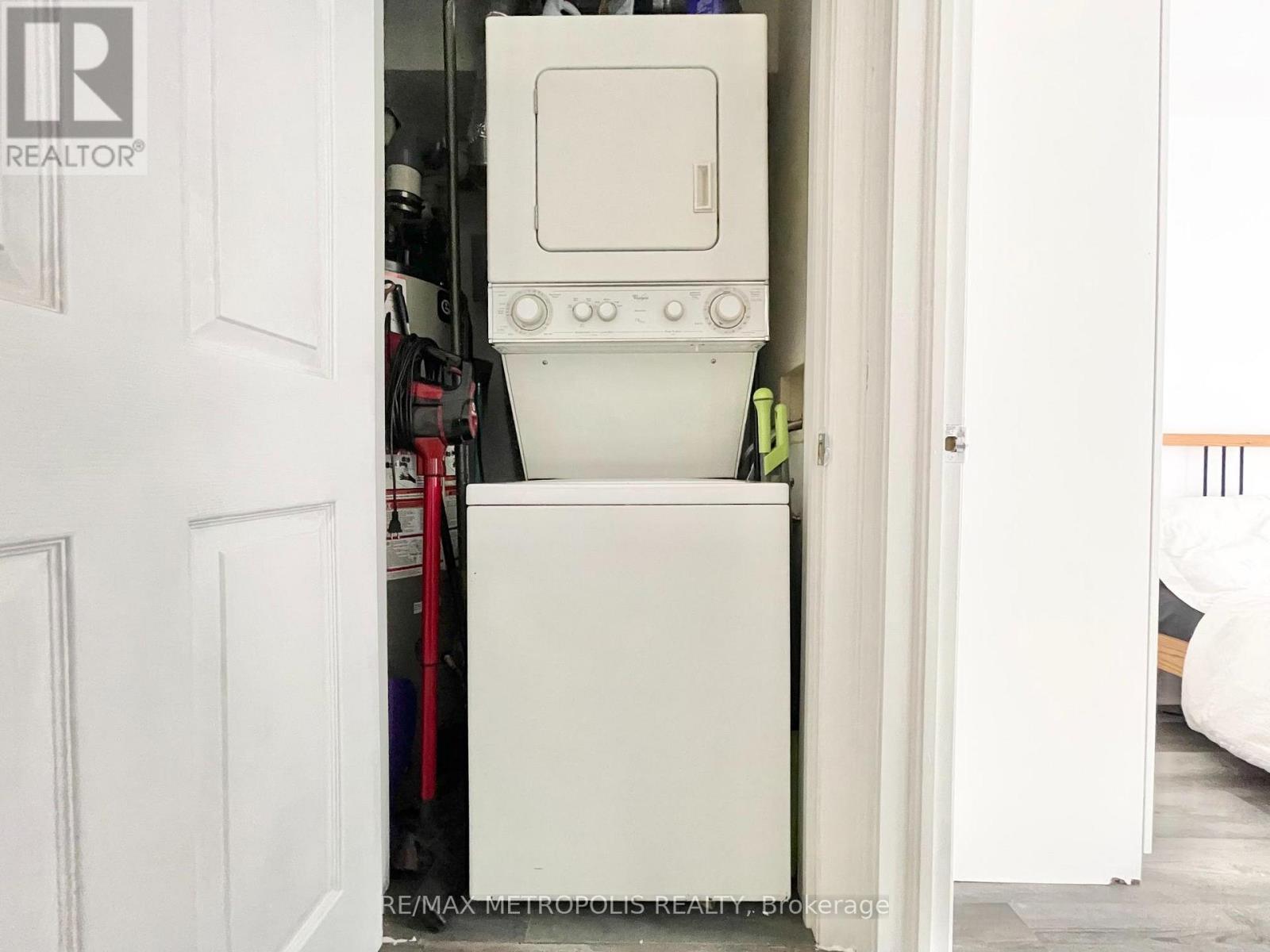 A white dishwasher is in a kitchen.