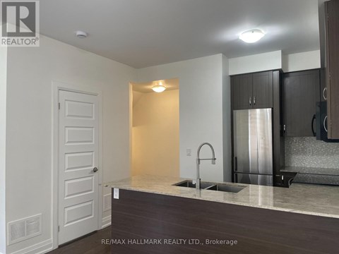 A modern kitchen with a sink and cabinets.