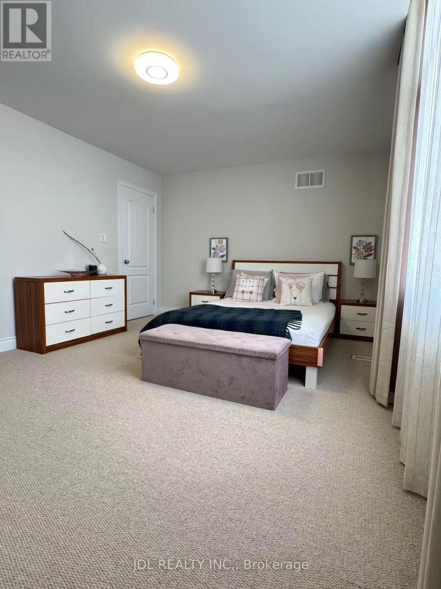 A bedroom with a bed, nightstand, and dresser.