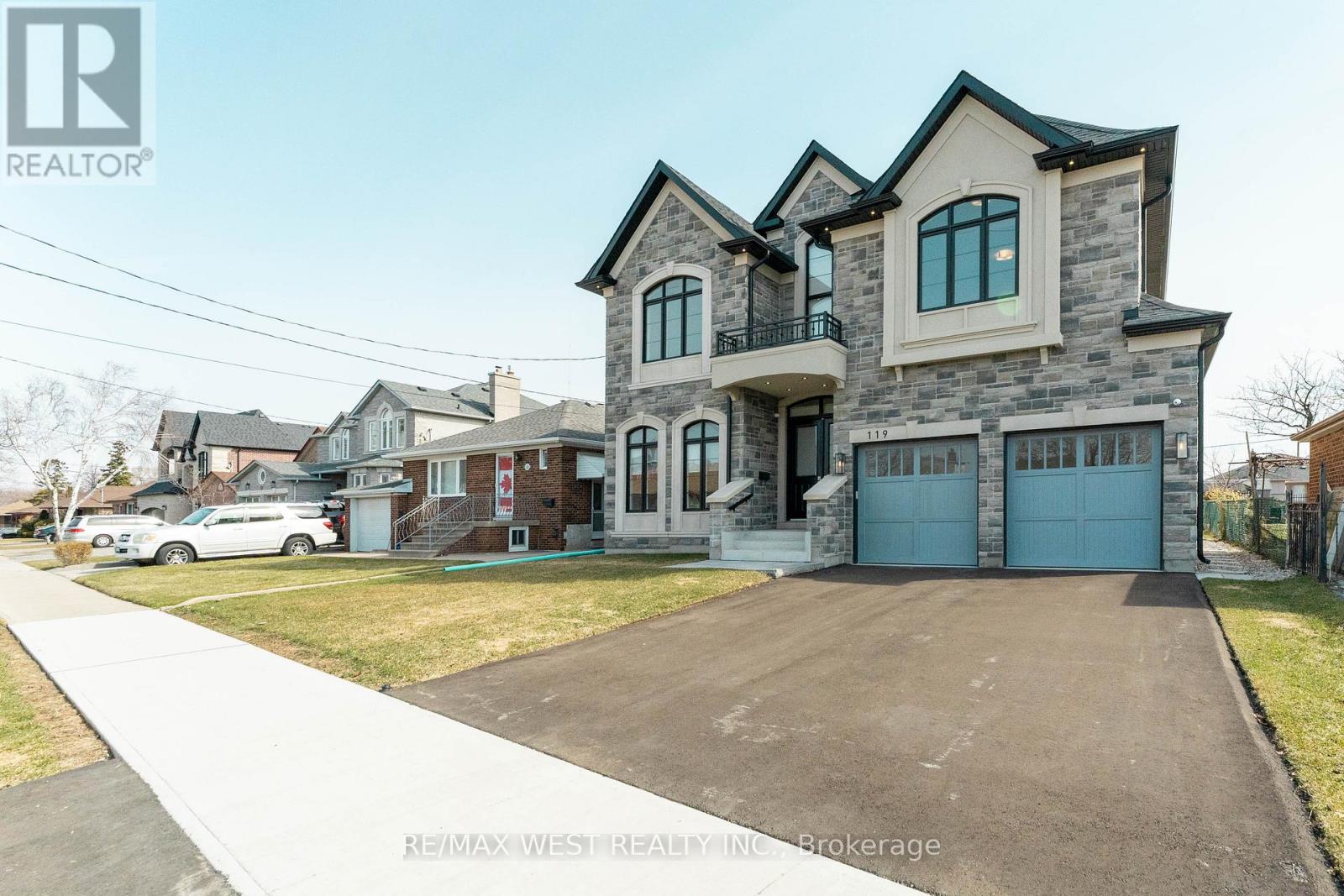 A large house with a garage is for sale.