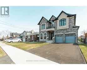 A large house with a garage is for sale.