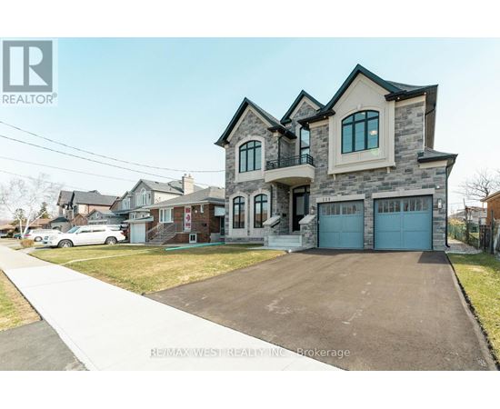 A large house with a garage is for sale.