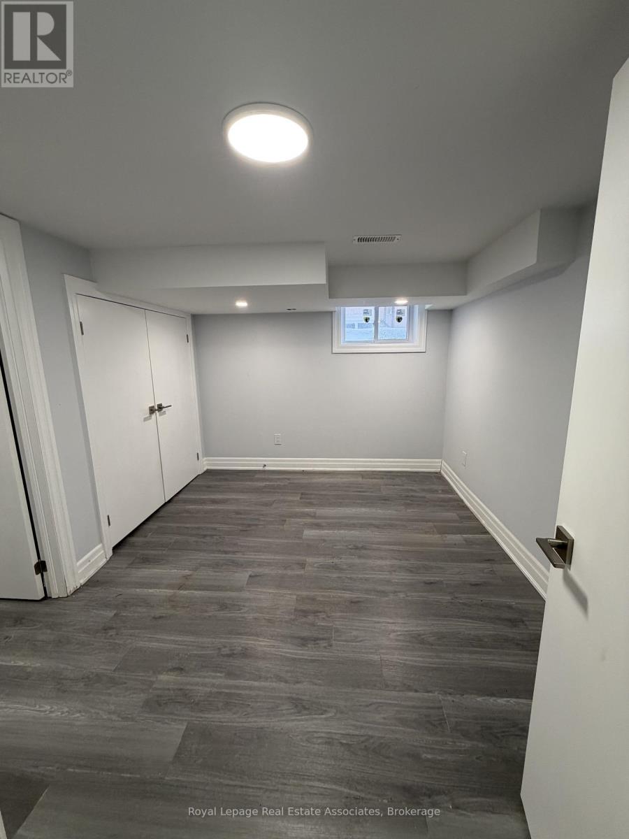 A room with a grey floor and white walls.