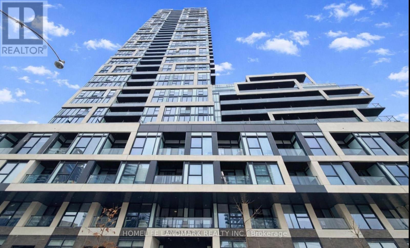 A tall building with a sign that says "HOME" on it.