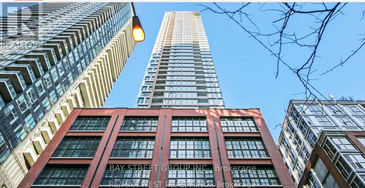 A tall building with the words Bay Street Group Inc. Brokerage on it.
