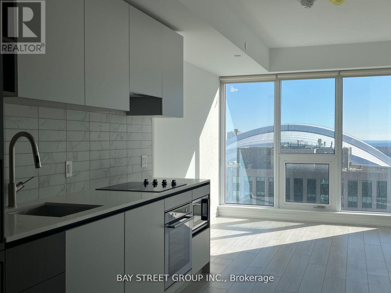 A modern kitchen with a view of the bridge outside.