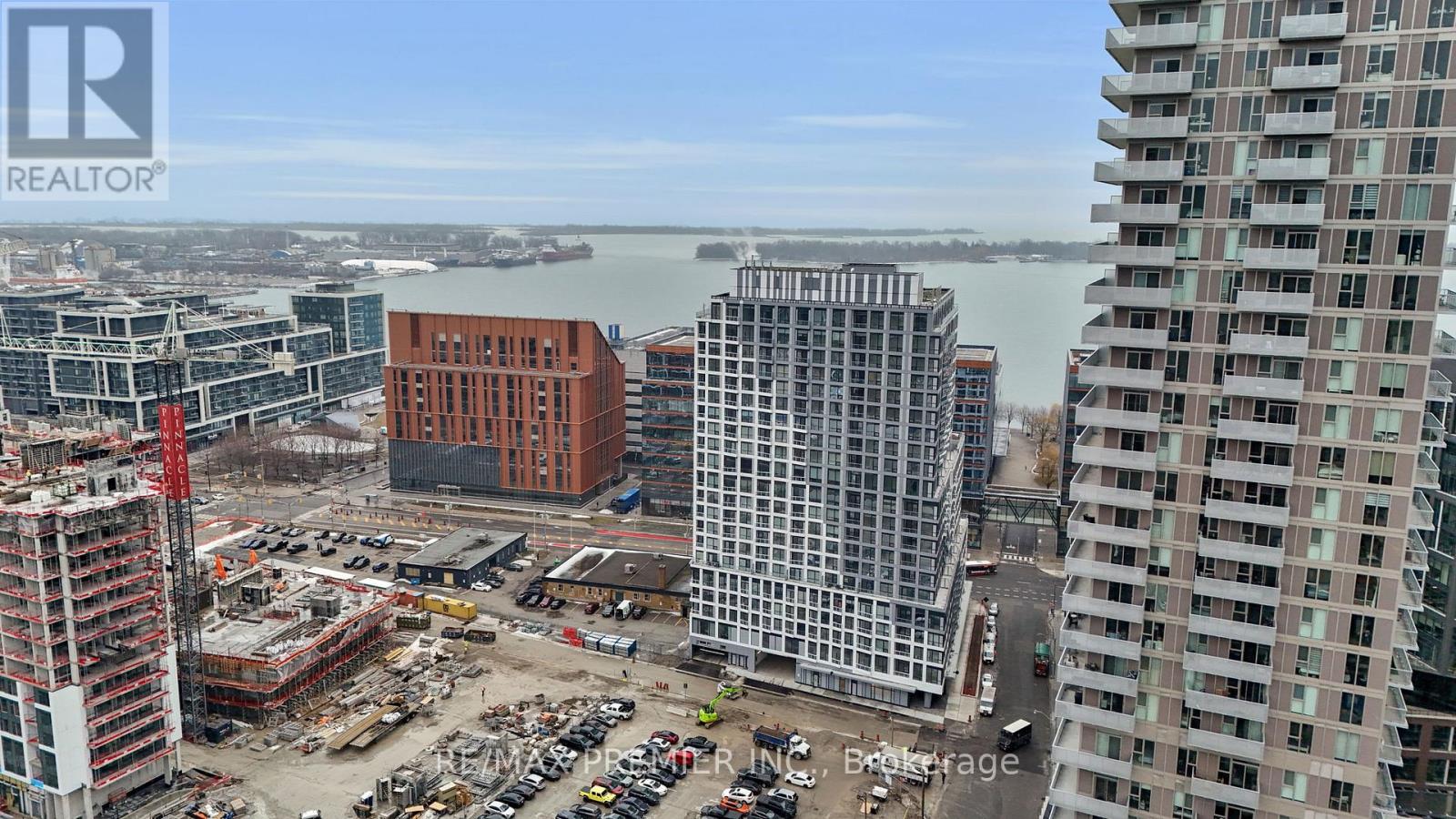 A construction site with a crane and a building under construction.