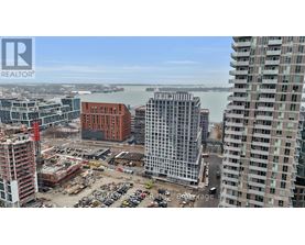 A construction site with a crane and a building under construction.