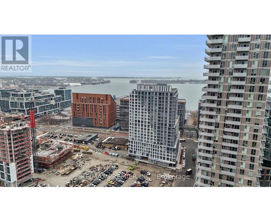 A construction site with a crane and a building under construction.