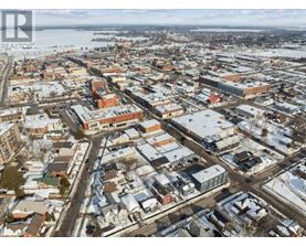 A bird's eye view of a city with buildings and roads.
