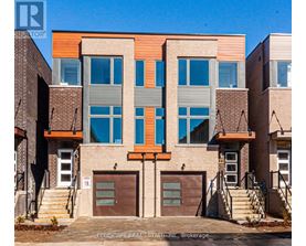 A modern two-story building with a mix of brick and wood paneling.