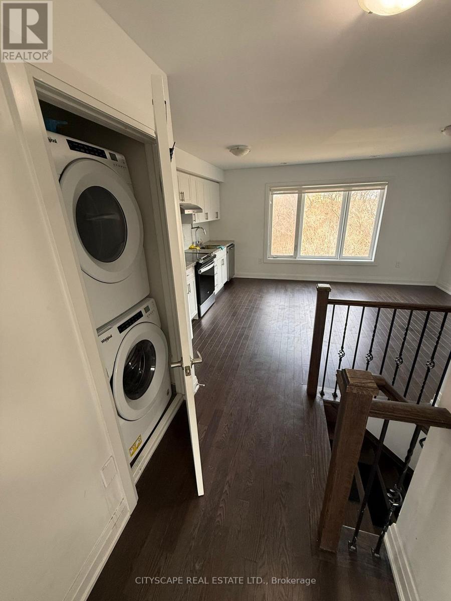 A laundry room with a washer and dryer in it.