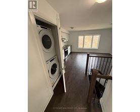 A laundry room with a washer and dryer in it.