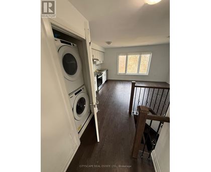 A laundry room with a washer and dryer in it.