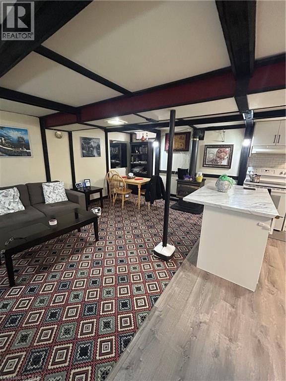 A room with a patterned carpet and a white table.