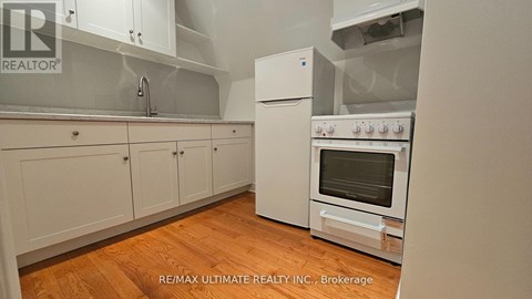 A white oven with a glass door is in a kitchen.