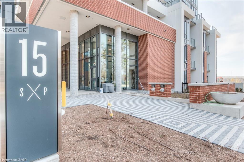 A realtor sign is in front of a building.