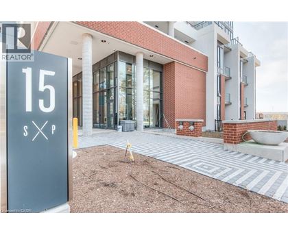 A realtor sign is in front of a building.