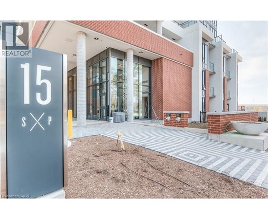 A realtor sign is in front of a building.