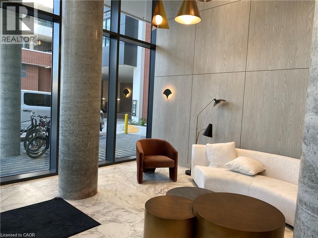 A modern living room with a sofa, armchair, and coffee table.