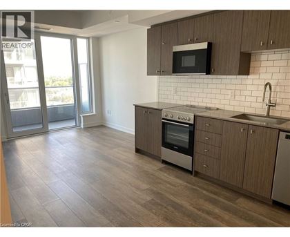 A kitchen with a stove top oven and microwave.