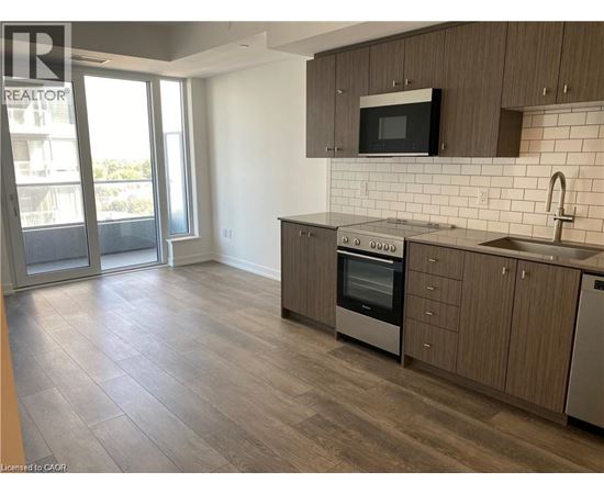 A kitchen with a stove top oven and microwave.