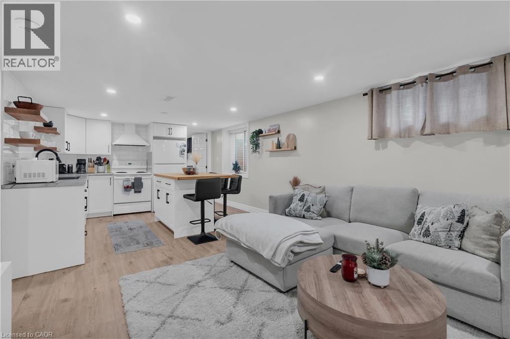 A modern living room with a grey couch and a wooden coffee table.