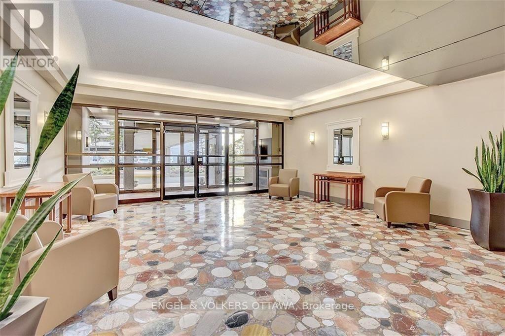 A spacious waiting area with a tiled floor and a mix of seating options.